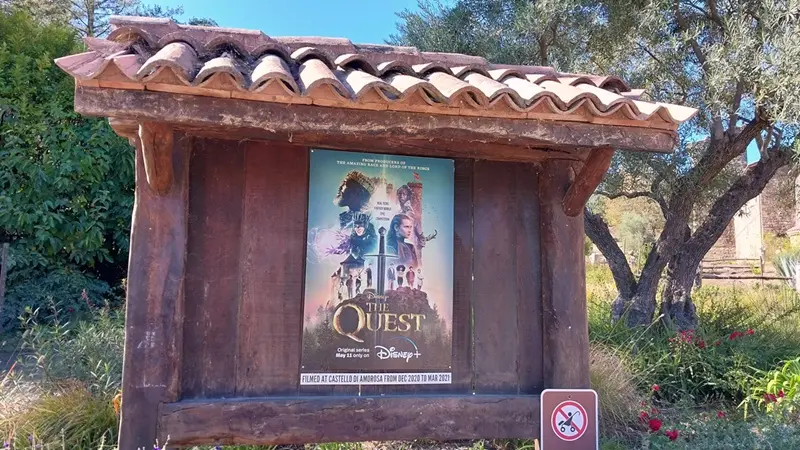 Promotional sign at Castello di Amorosa showing the filming location for Disney's The Quest during a San Francisco to Napa Valley day trip