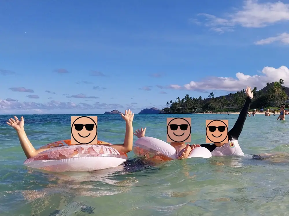 Travelers swimming and playing safely in the calm, turquoise waters with practical Lanikai Beach tips