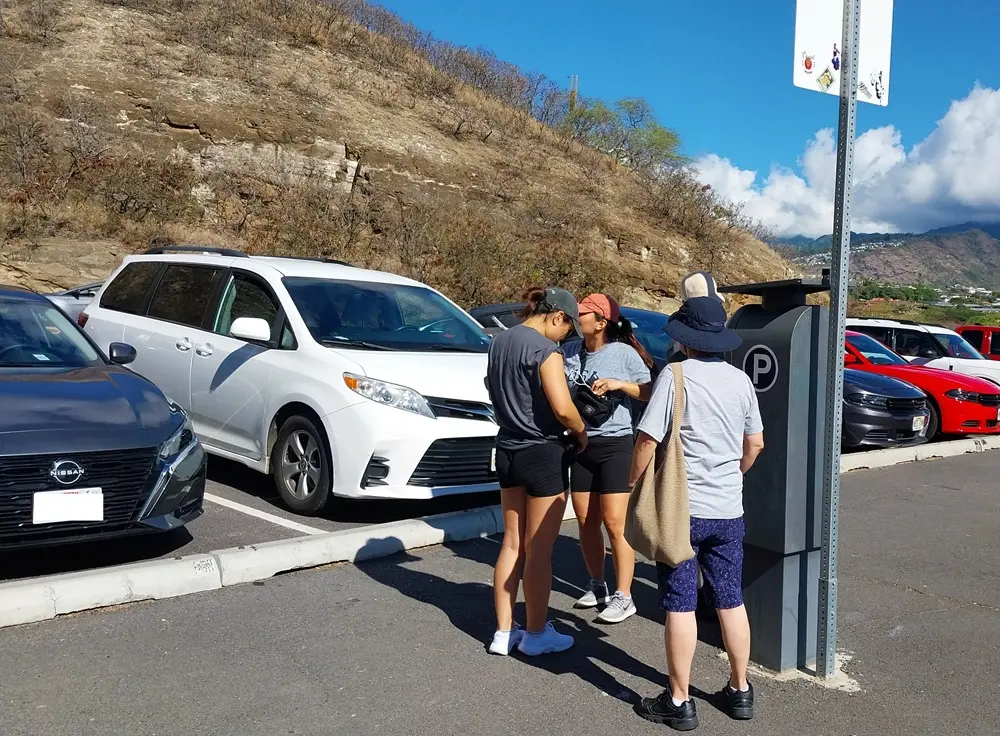 The paid parking lot located right in front of the tunnel entrance for visitors starting their diamond head hike