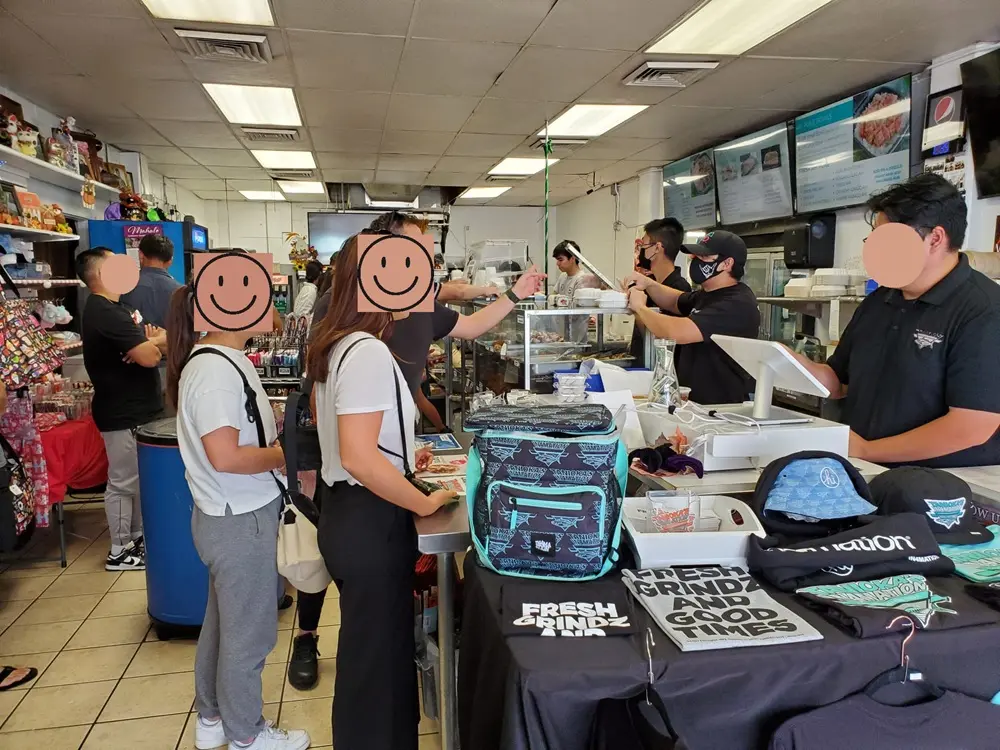 Ordering fresh Hawaiian poke and lunch boxes inside Tanioka's Seafood & Catering during an Oahu Hawaii first day itinerary