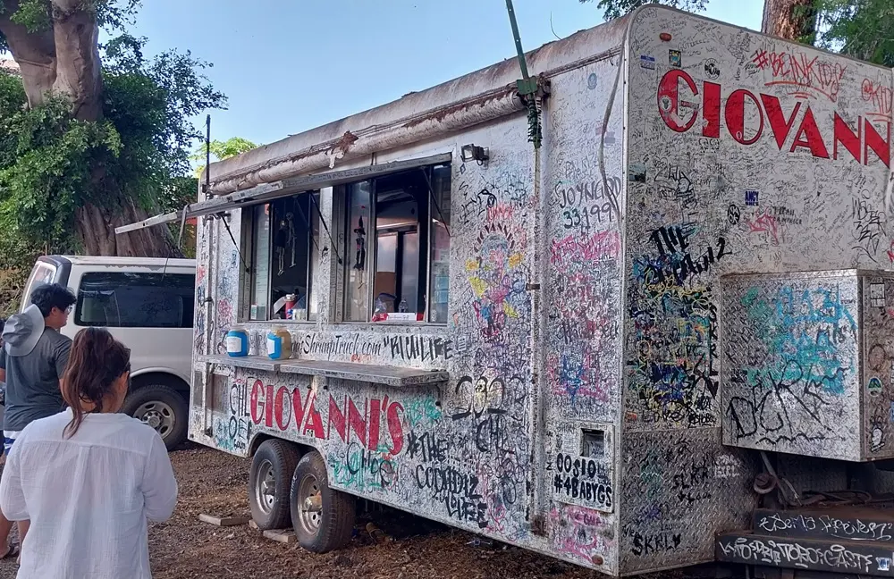 Giovanni's Shrimp Truck exterior with graffiti which I visited for lunch before starting my hawaii oahu day3 snorkeling trip.